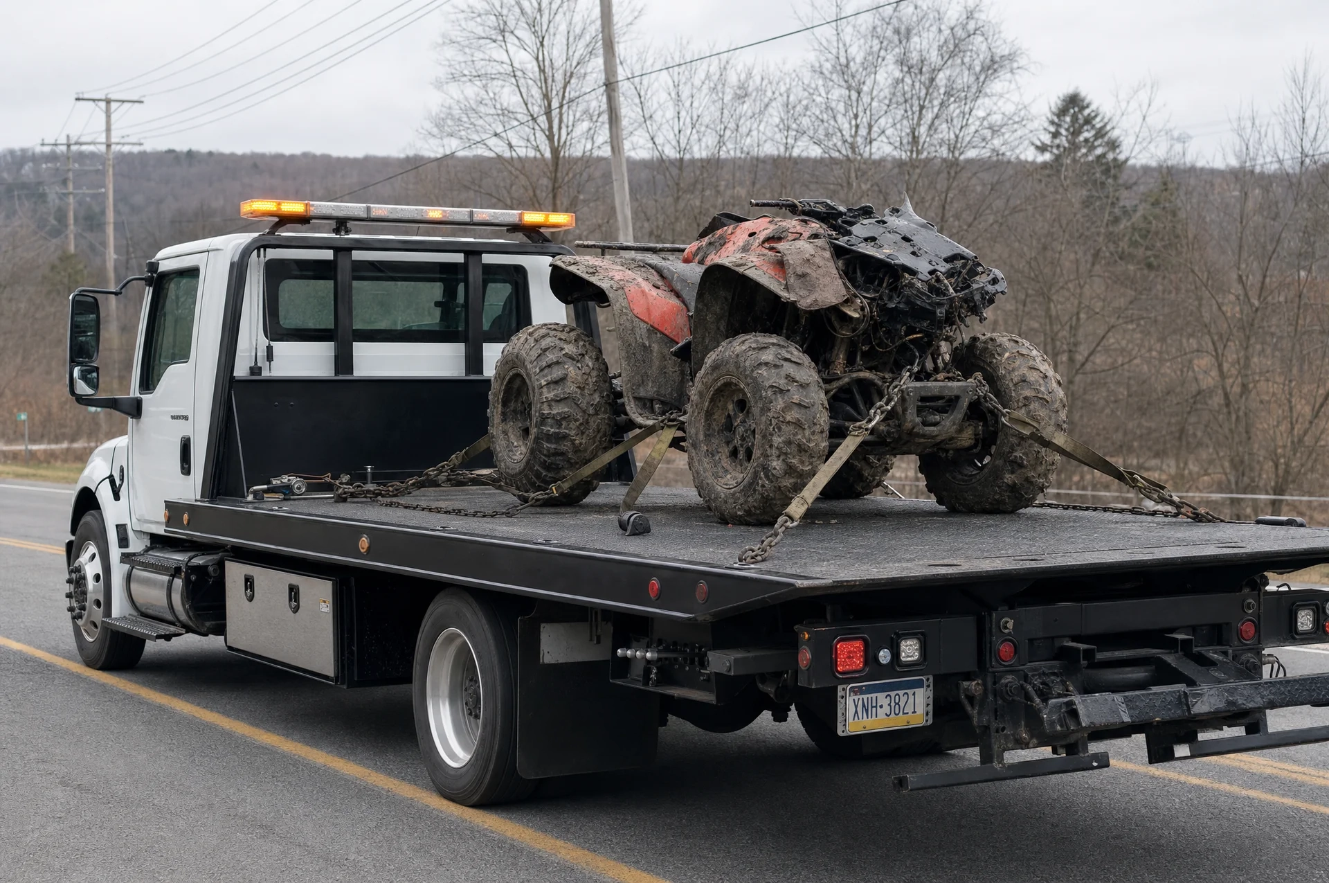 Flatbed towing a low-clearance car